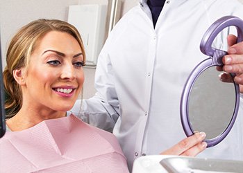 Smiling after a successful procedure covered by Humana Dental insurance